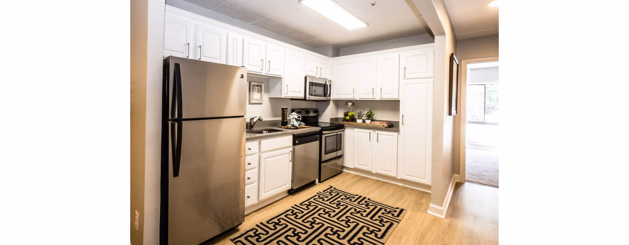 Spacious kitchen with modern appliances at Avana Weymouth Apartments