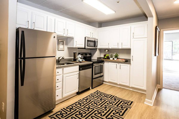Spacious kitchen with modern appliances at Avana Weymouth Apartments
