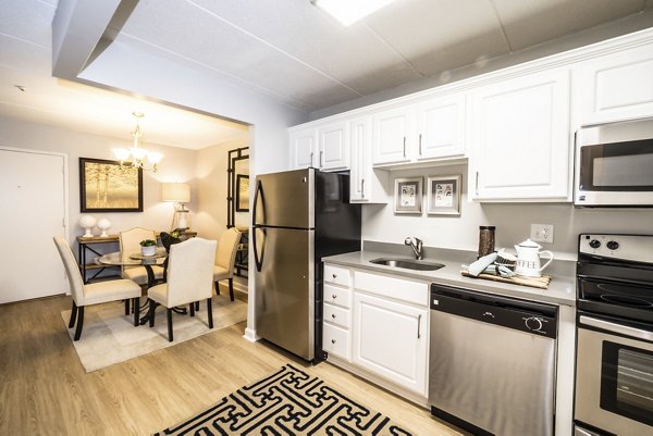 Modern kitchen with stainless steel appliances and granite countertops at Avana Weymouth Apartments