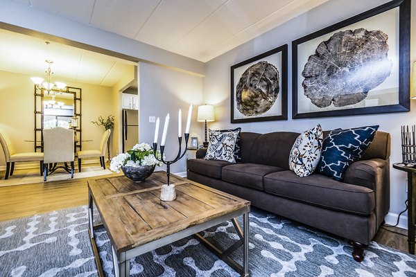 Spacious living room with modern decor at Avana Weymouth Apartments