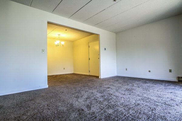 Spacious living room with modern decor and natural light in Avana Weymouth Apartments