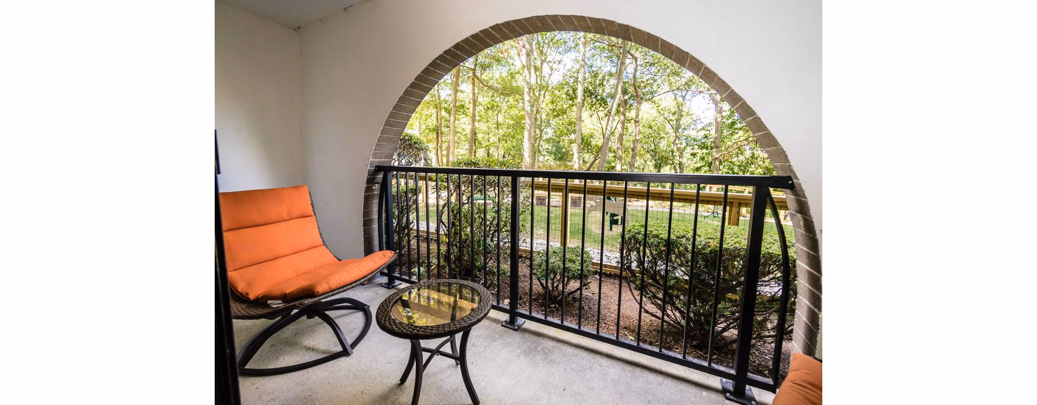 Relaxing patio with comfortable seating at Avana Weymouth Apartments