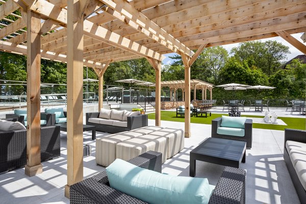 Patio featuring stylish outdoor furniture at Avana Weymouth Apartments