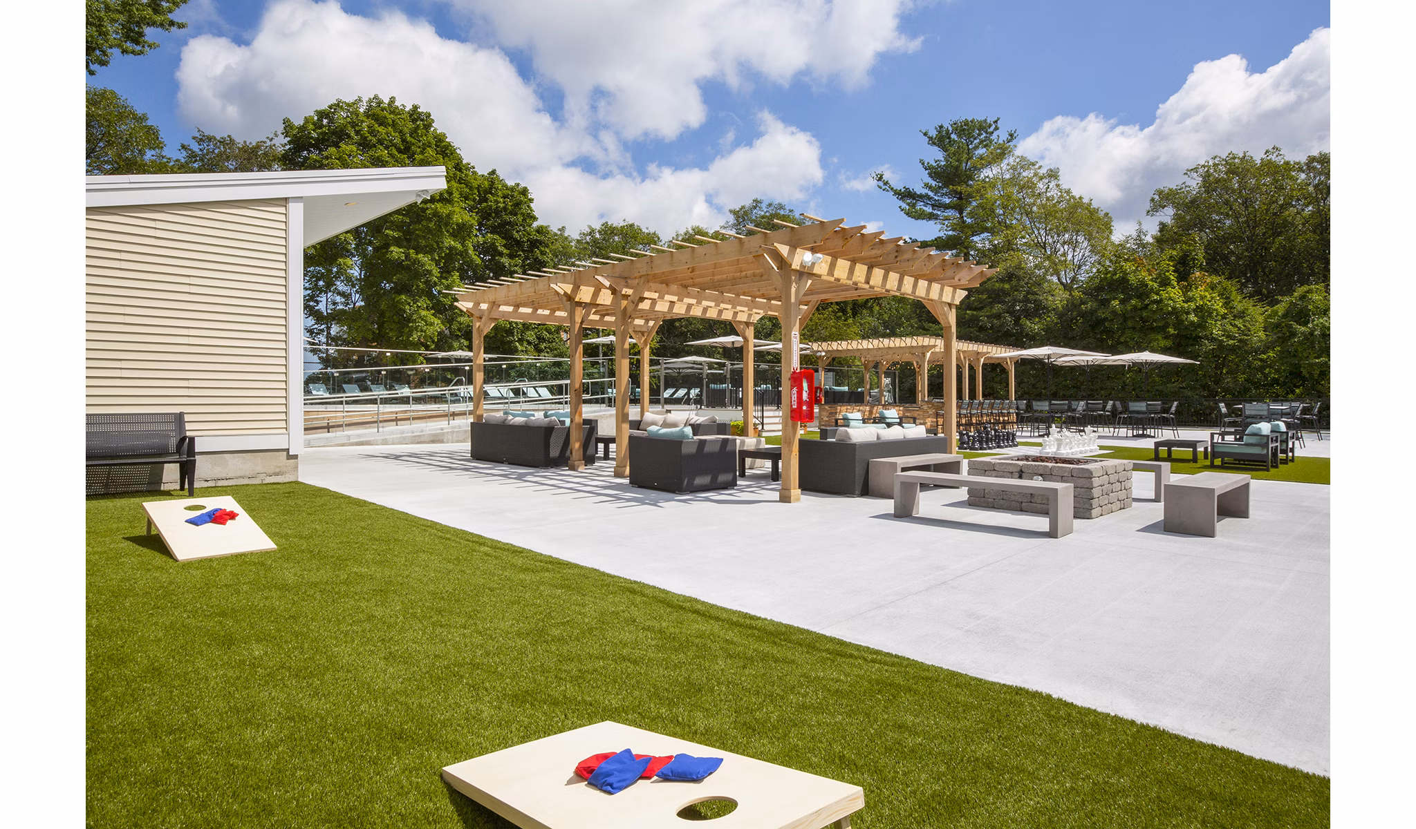 Sport court for basketball and tennis at Avana Weymouth Apartments, featuring well-maintained surfaces and lighting for sports enthusiasts