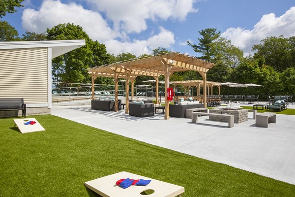 Sport court for basketball and tennis at Avana Weymouth Apartments, featuring well-maintained surfaces and lighting for sports enthusiasts