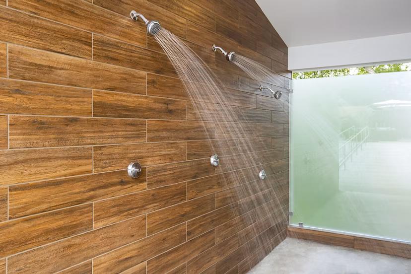 Modern pool showers at Avana Weymouth Apartments offering convenience and style