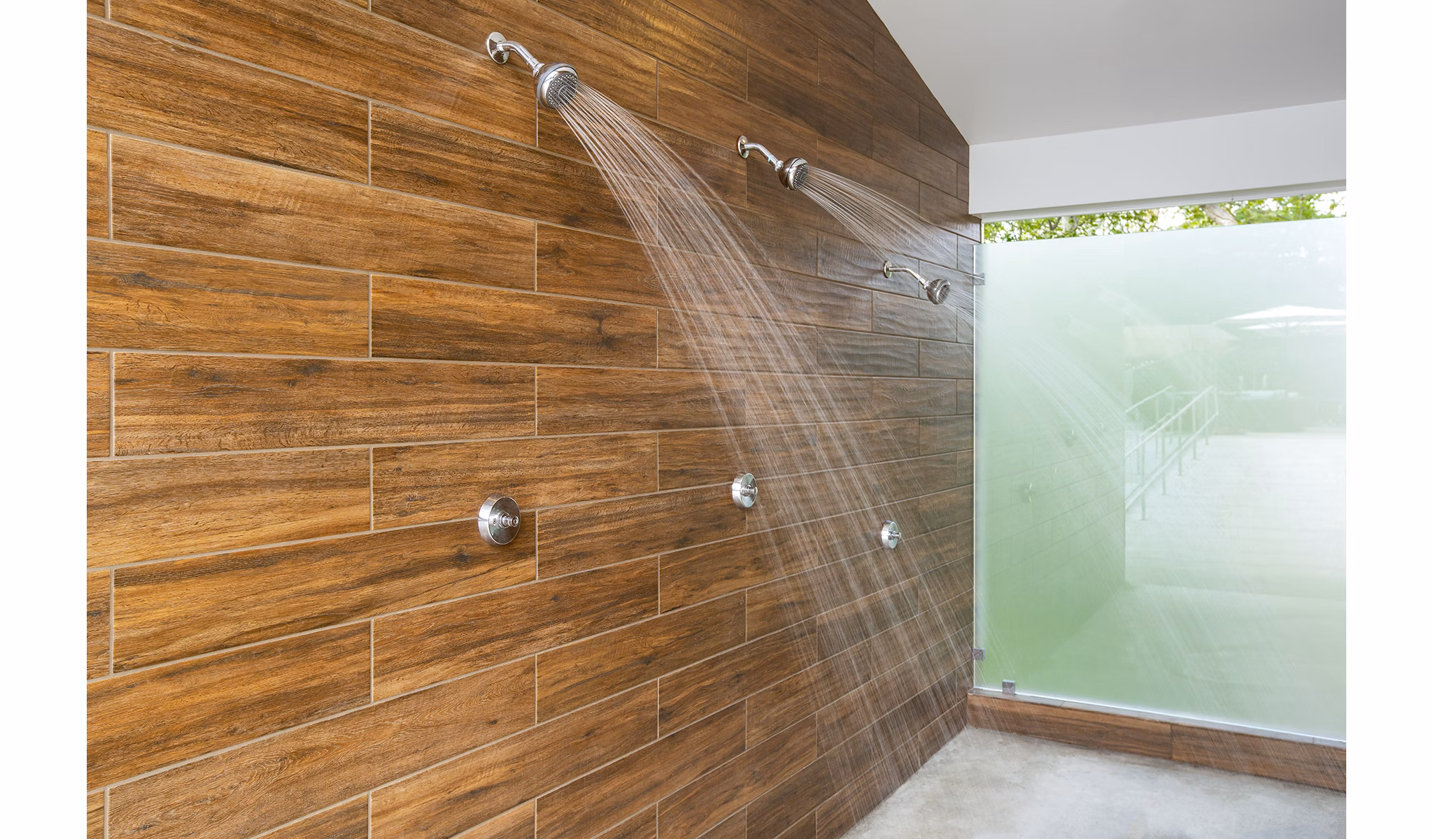 Modern pool showers at Avana Weymouth Apartments offering convenience and style