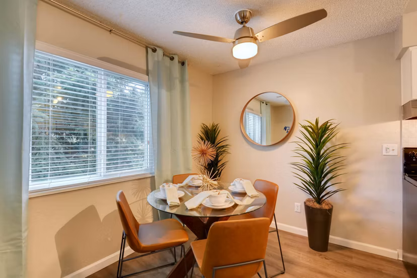 Dining room featuring modern decor and elegant lighting in Park Place at 92nd Apartments