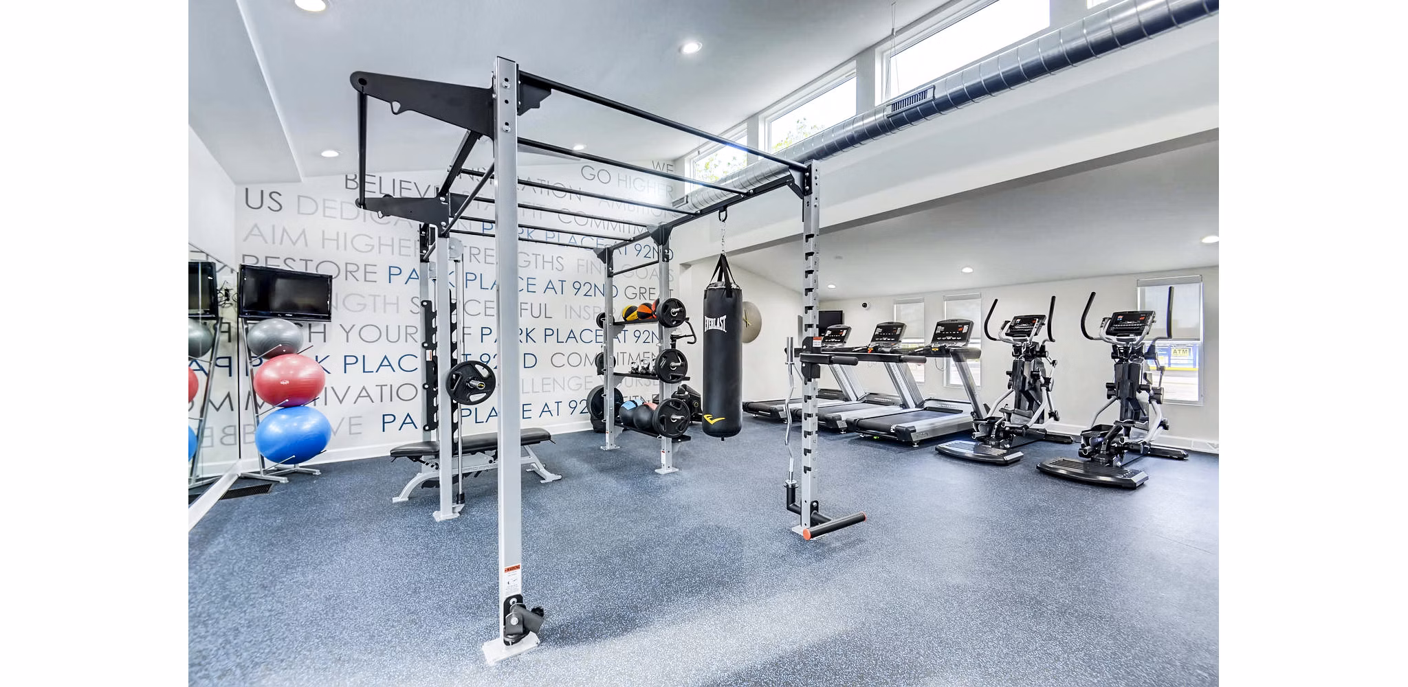 State-of-the-art fitness center with modern equipment at Park Place at 92nd Apartments