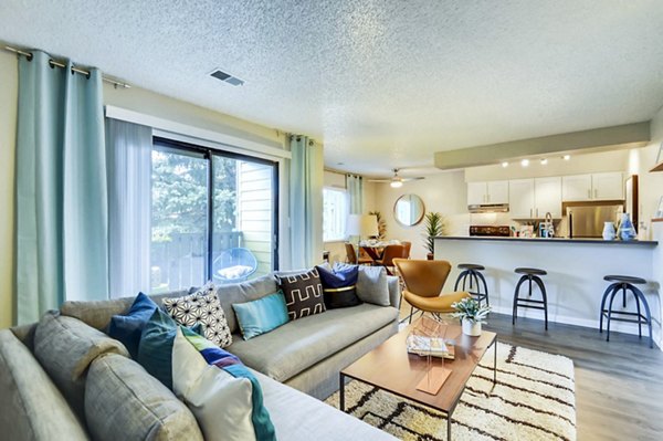 Spacious living room with modern dÃ©cor at Park Place at 92nd Apartments