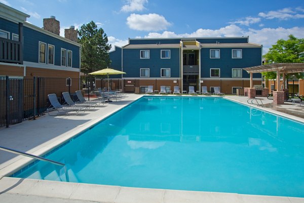 Luxurious pool at Park Place at 92nd Apartments featuring spacious lounging areas