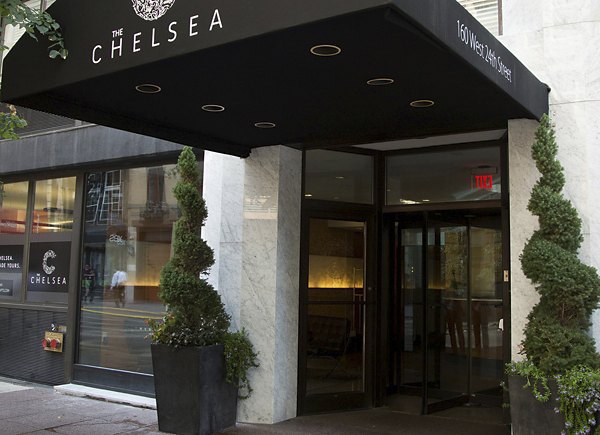 Entrance of The Chelsea building with black awning at The Chelsea Apartments