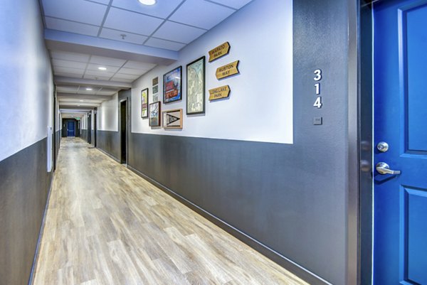 Bright hallway featuring modern lighting and sleek design at VUE25 Apartments