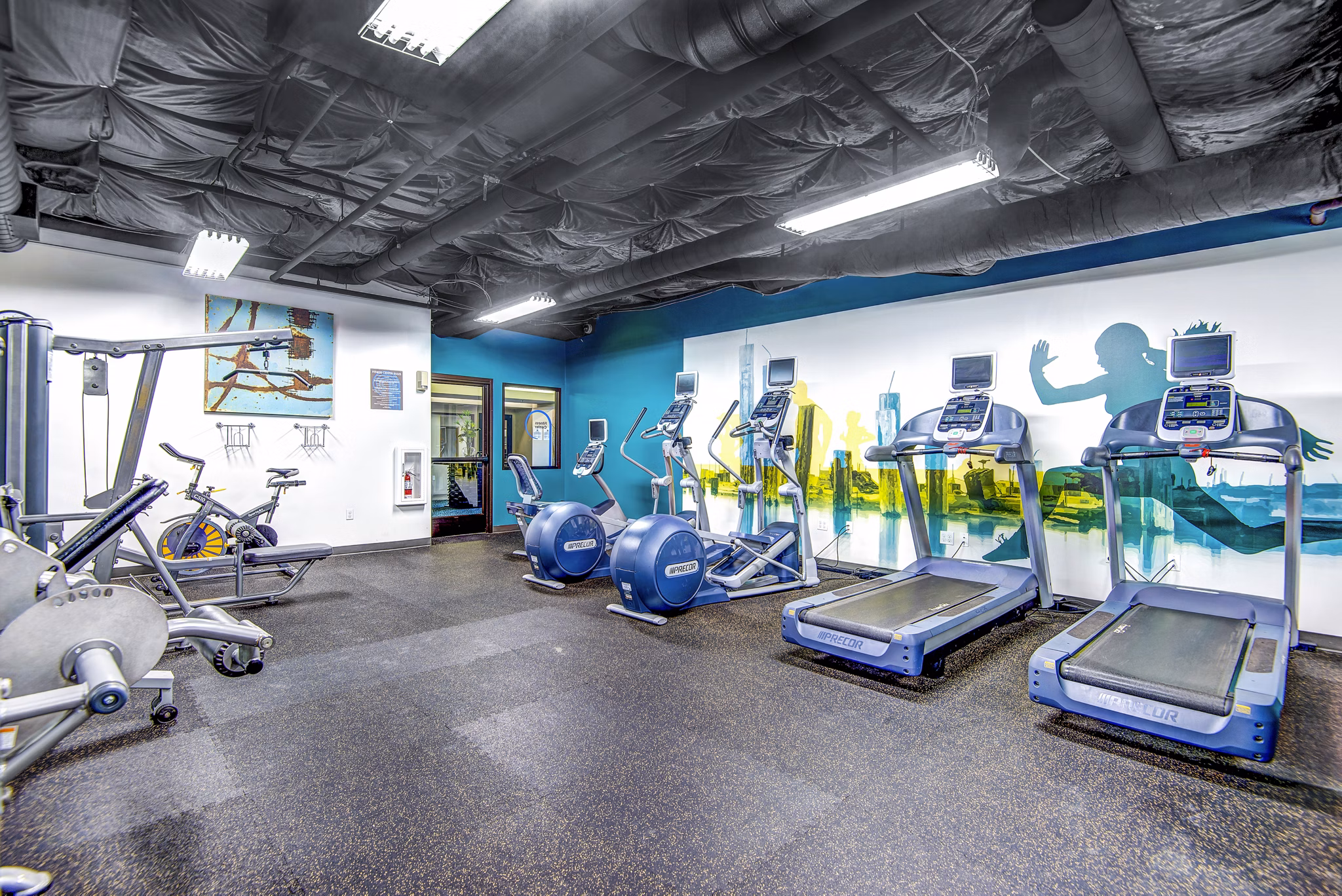 Modern fitness center with state-of-the-art equipment at VUE25 Apartments