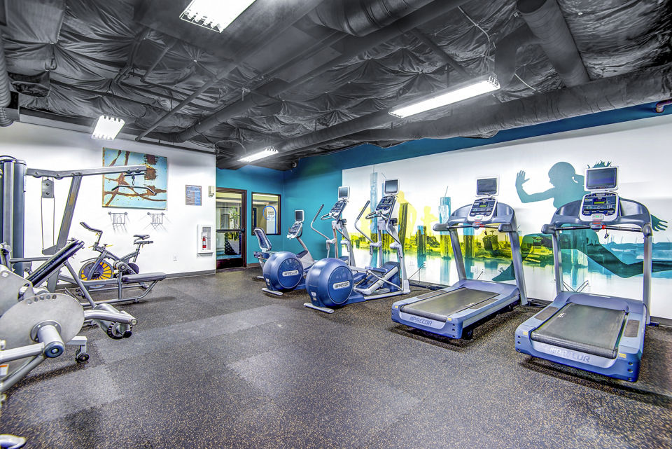 Modern fitness center with state-of-the-art equipment at VUE25 Apartments