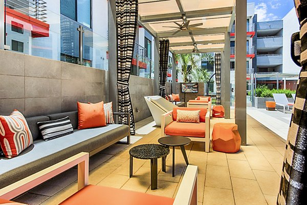 Spacious pool patio with lounging furniture at The Tomscot Apartments, luxurious living in a prime location