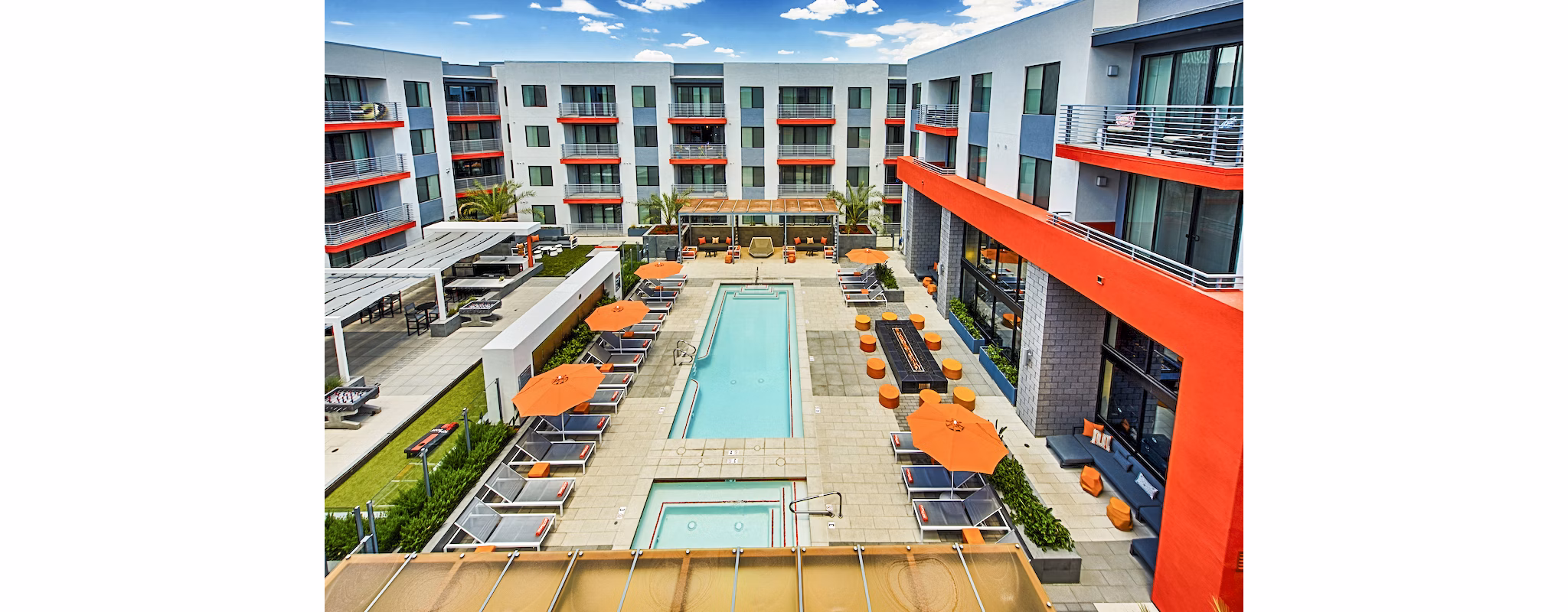 Luxurious poolside retreat at The Tomscot Apartments featuring cabanas and lounge seating