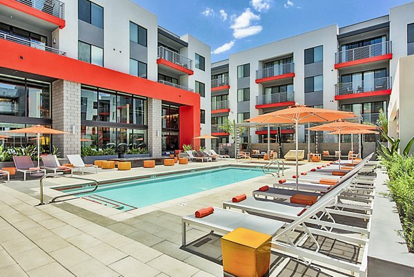 Resort-style pool with lounge chairs at The Tomscot Apartments, offering luxury living in a vibrant Scottsdale community