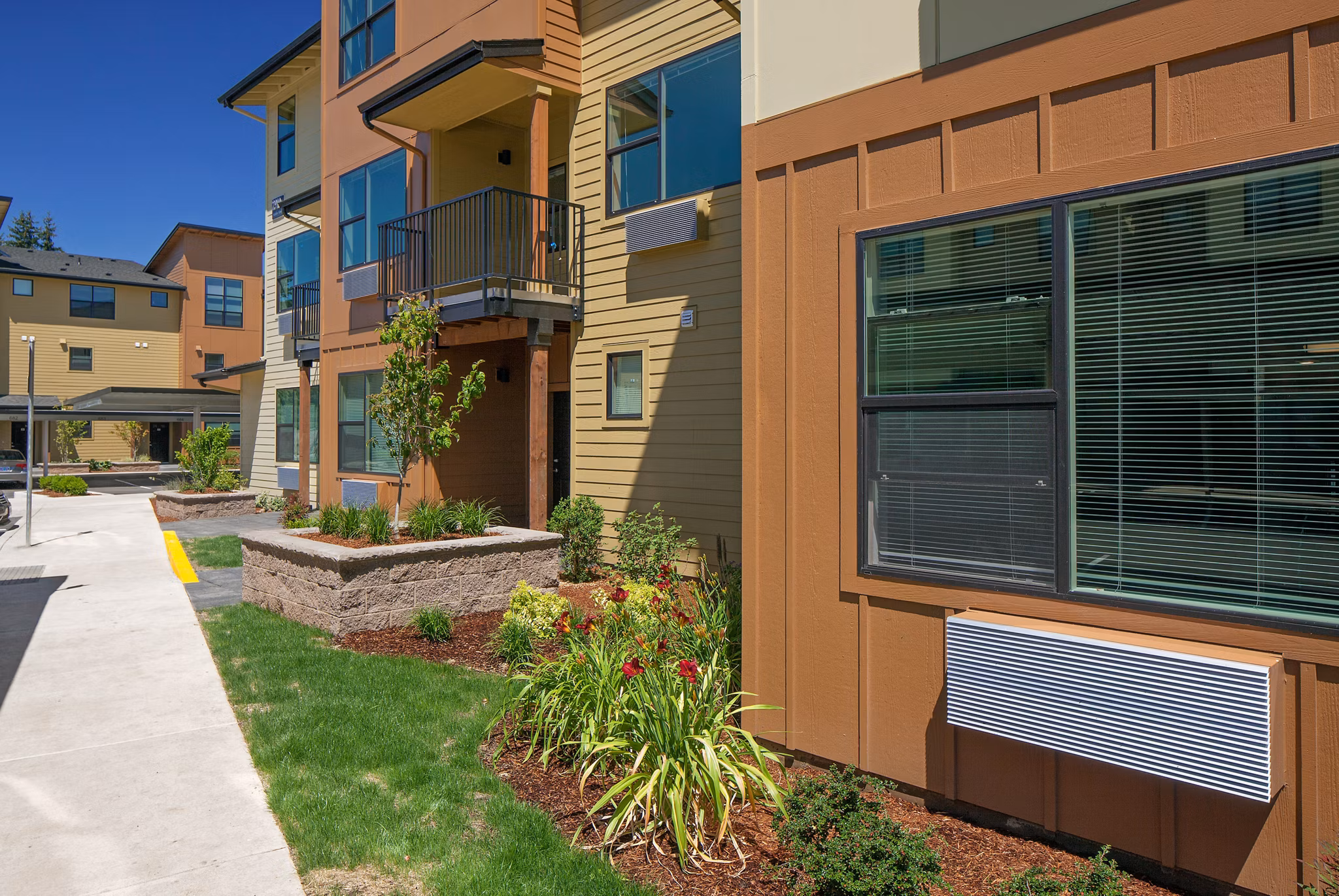 The Tennyson at Crescent Village: Luxury apartment showcasing sleek design in a vibrant community setting