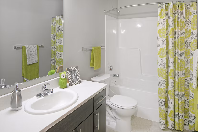 Modern bathroom with sleek fixtures at The Tennyson at Crescent Village Apartments