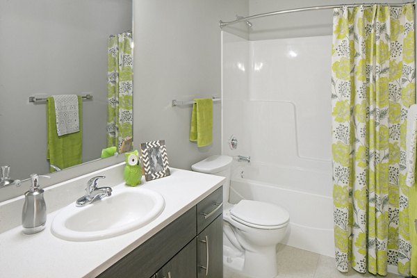 Modern bathroom with sleek fixtures at The Tennyson at Crescent Village Apartments
