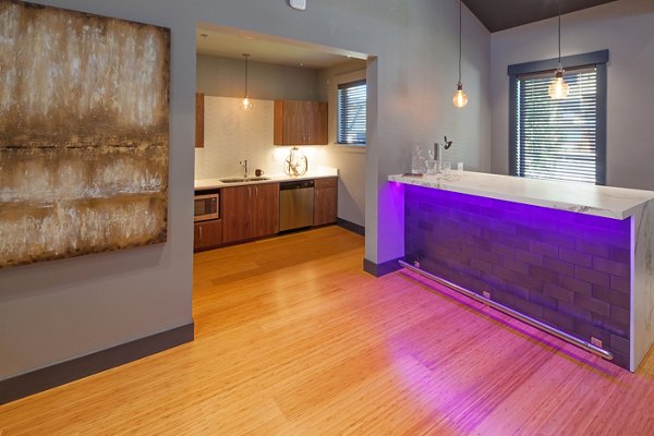 The Tennyson at Crescent Village: Elegant clubhouse featuring modern decor and comfortable seating in upscale luxury apartments