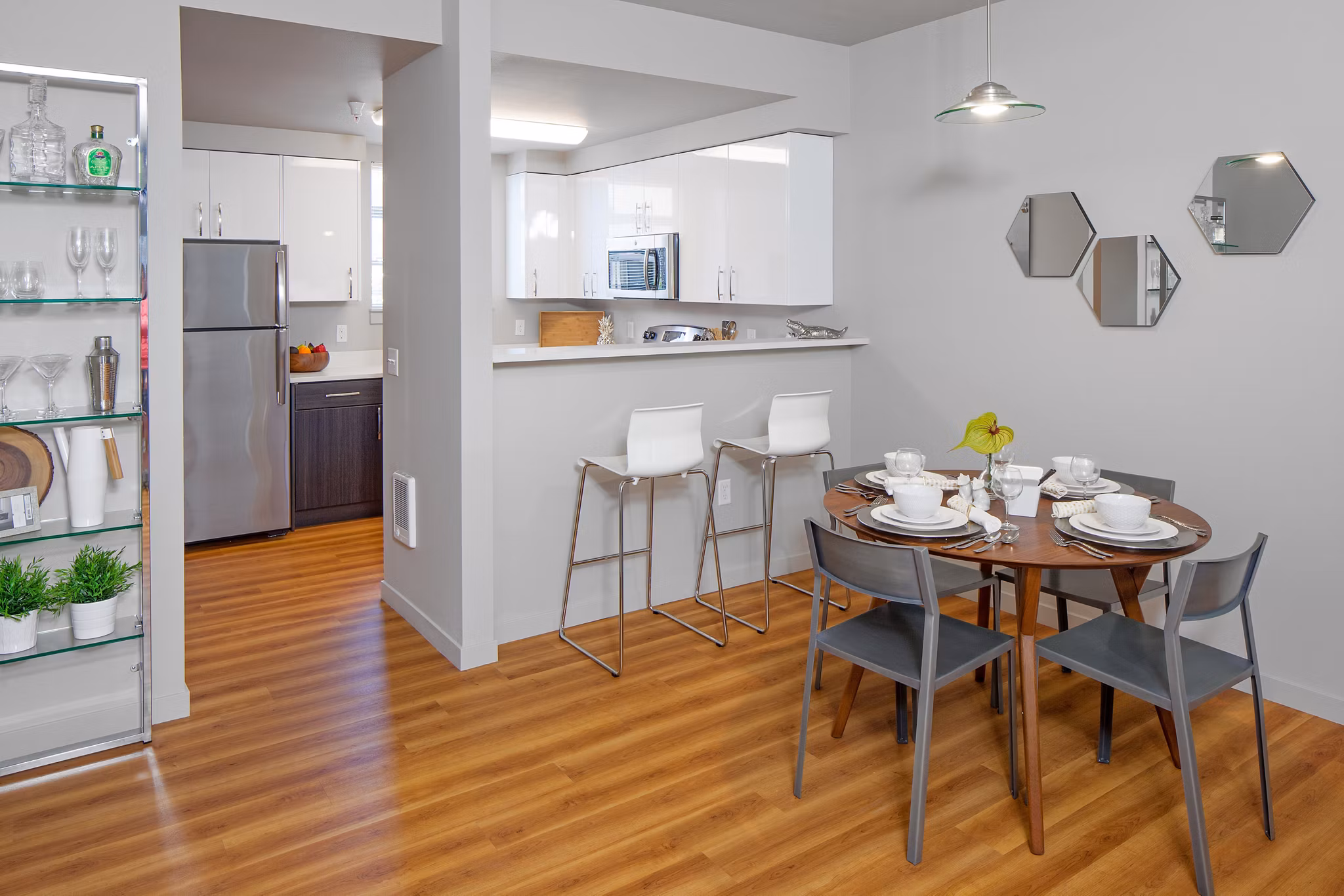 Elegant dining room with modern furnishings at The Tennyson at Crescent Village Apartments