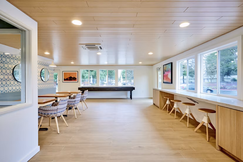 Clubhouse featuring modern design and gathering spaces at Lineage at Willow Creek Apartments
