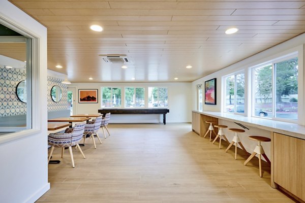 Clubhouse featuring modern design and gathering spaces at Lineage at Willow Creek Apartments
