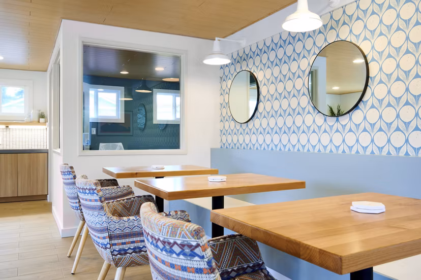Clubhouse featuring modern design and cozy seating areas at Lineage at Willow Creek Apartments