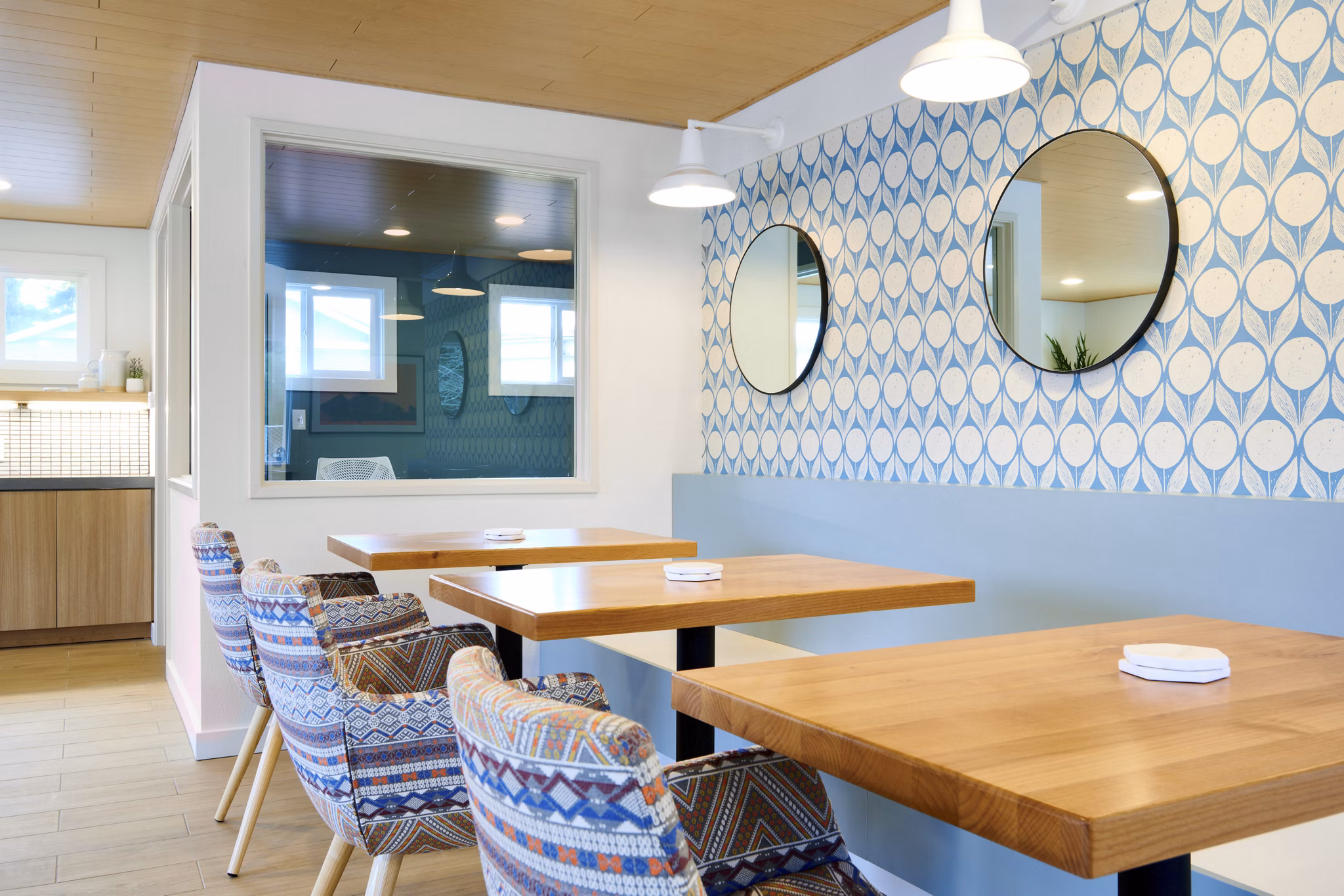 Clubhouse featuring modern design and cozy seating areas at Lineage at Willow Creek Apartments