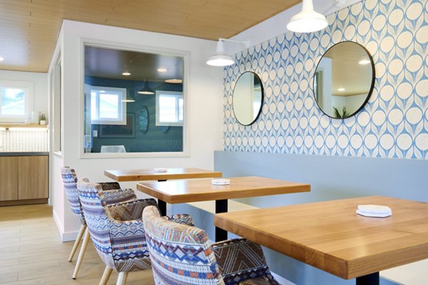 Clubhouse featuring modern design and cozy seating areas at Lineage at Willow Creek Apartments