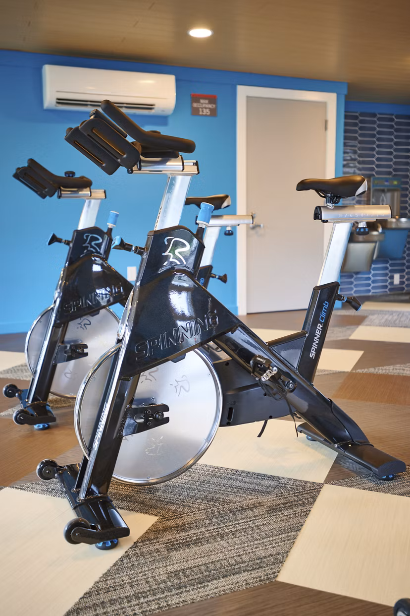 Modern fitness center with state-of-the-art equipment at Lineage at Willow Creek Apartments