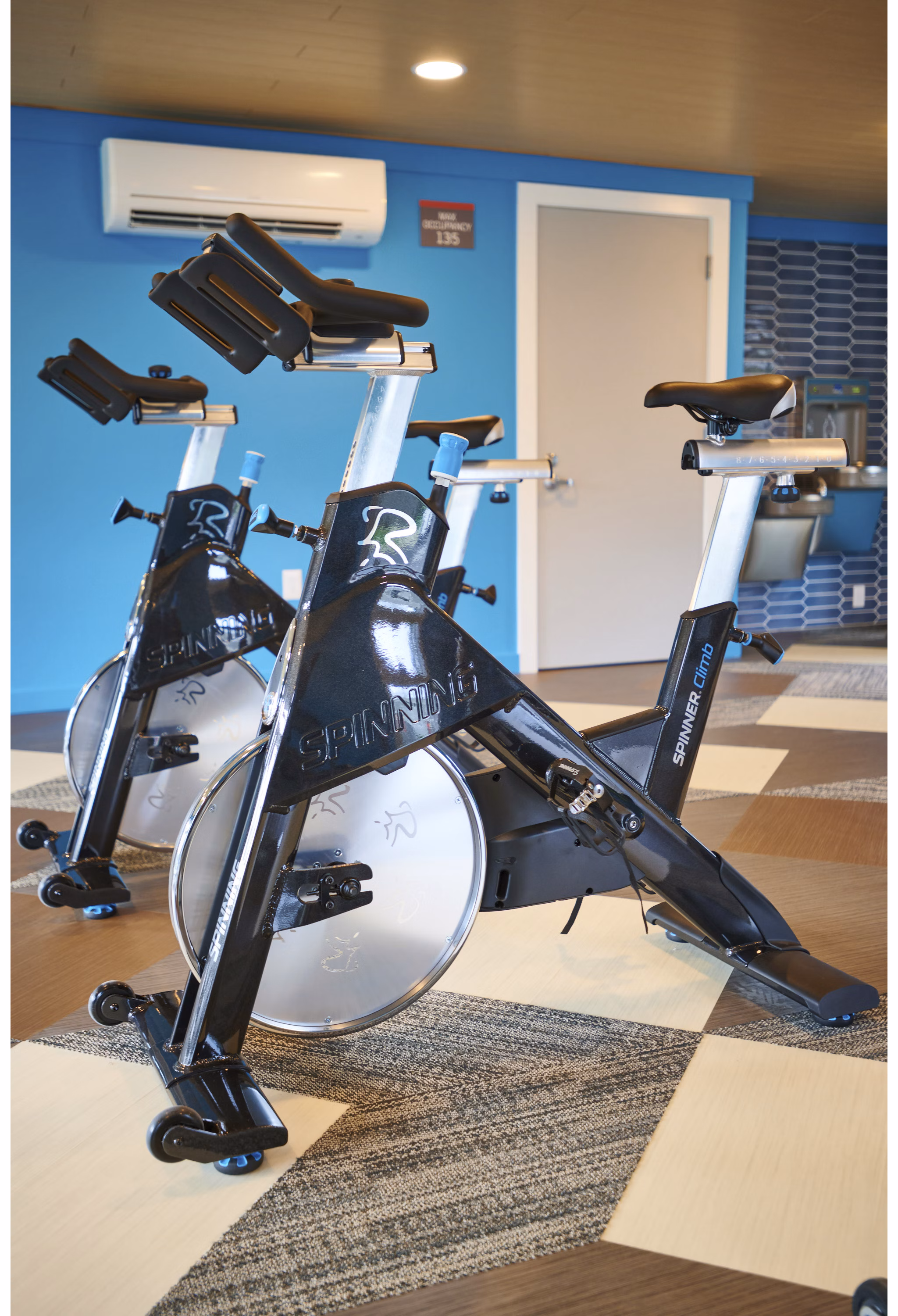 Modern fitness center with state-of-the-art equipment at Lineage at Willow Creek Apartments