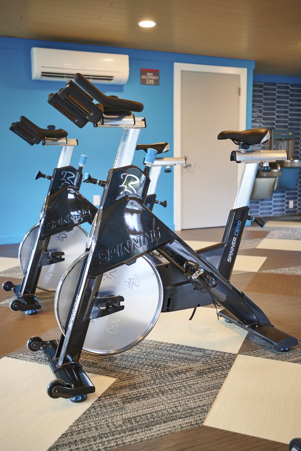 Modern fitness center with state-of-the-art equipment at Lineage at Willow Creek Apartments
