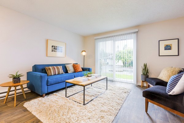 Spacious living room with contemporary decor at Lineage at Willow Creek Apartments