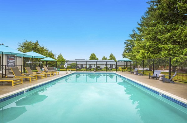 Resort-style pool area with cabanas at Lineage at Willow Creek Apartments, a Greystar luxury community