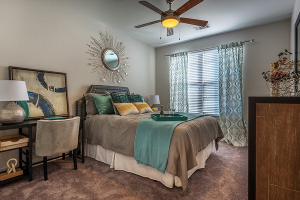 Cozy bedroom with elegant decor at Fountains Matthews Apartments