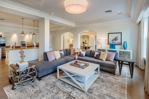 Cozy living room with stylish decor and natural light in Fountains Matthews Apartments