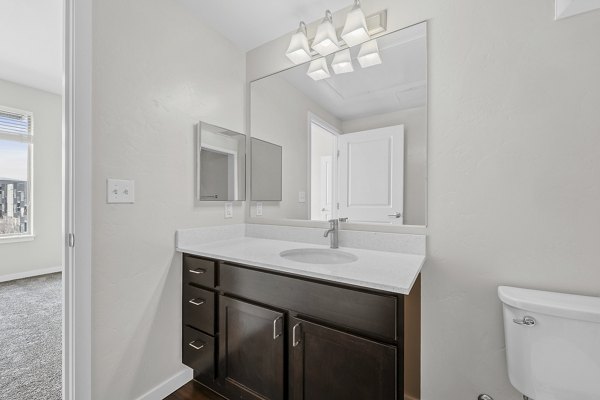 Sleek bathroom featuring modern fixtures at Confluence at Three Springs Apartments