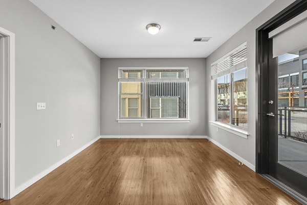 Spacious living room with modern decor in Confluence at Three Springs luxury apartments