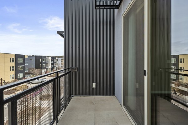 Scenic balcony at Confluence at Three Springs Apartments offering mountain views and outdoor seating for relaxed living experience