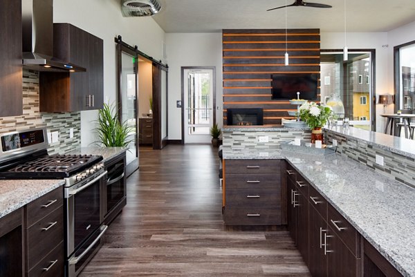 Clubhouse featuring modern seating and entertainment area at Jake at Indian Trail Apartments