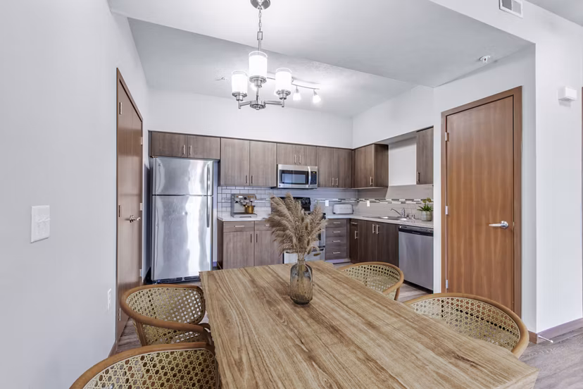 Dining room featuring modern decor and elegant lighting in Jake at Indian Trail Apartments