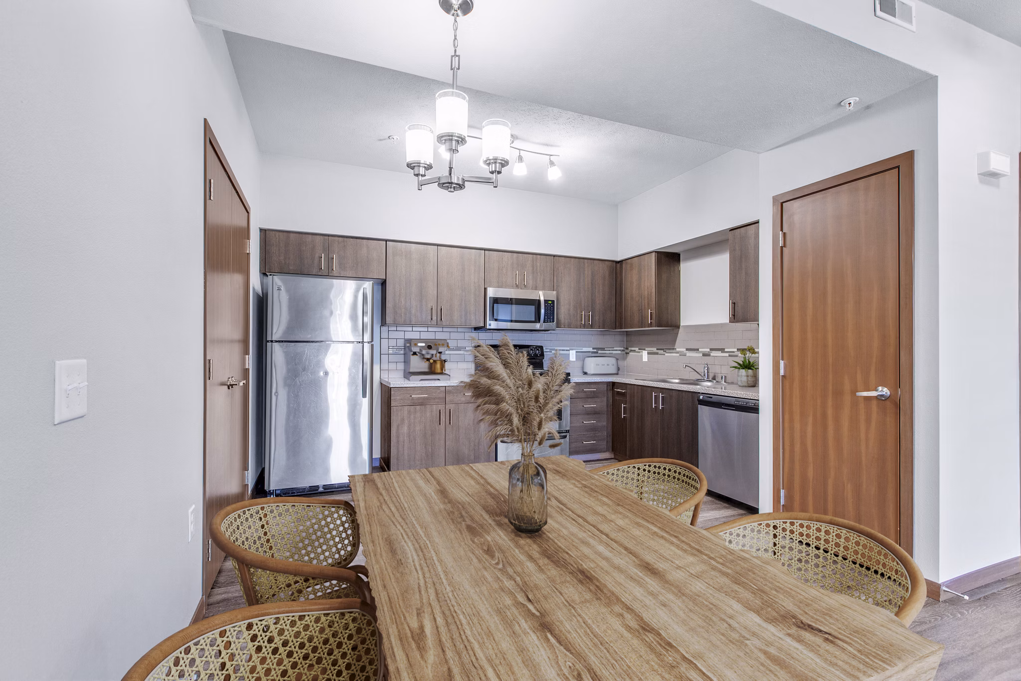 Dining room featuring modern decor and elegant lighting in Jake at Indian Trail Apartments