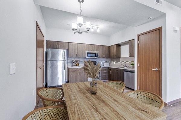 Dining room featuring modern decor and elegant lighting in Jake at Indian Trail Apartments