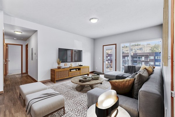 Spacious living room with modern decor at Jake at Indian Trail Apartments, offering luxury living in a vibrant community setting
