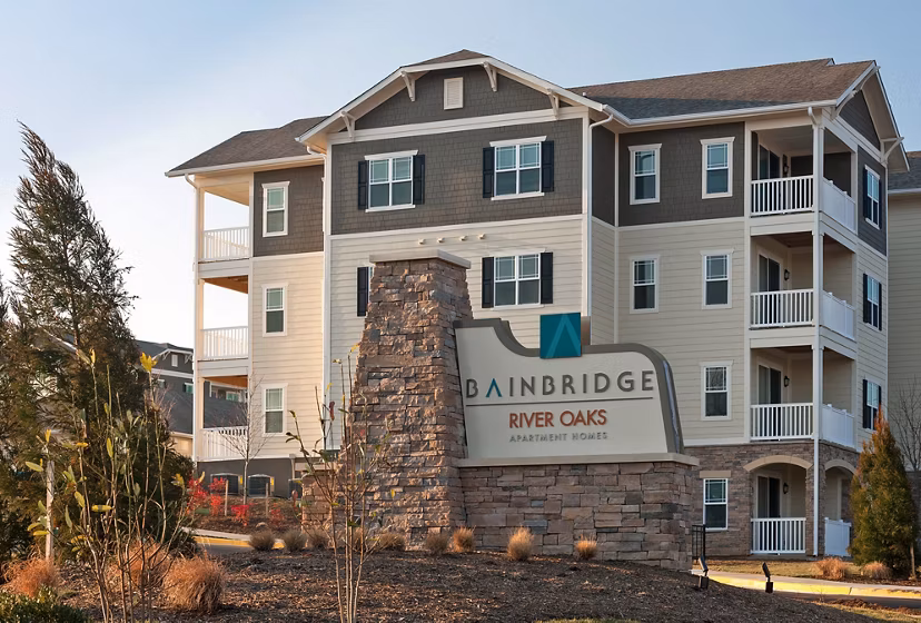 River Oaks Apartments: Welcoming signage at the entrance of luxury living spaces