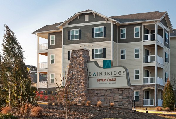 River Oaks Apartments: Welcoming signage at the entrance of luxury living spaces