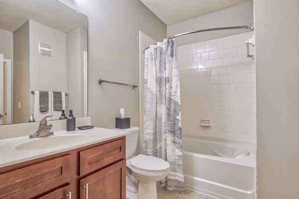 Luxurious bathroom with modern fixtures at River Oaks Apartments